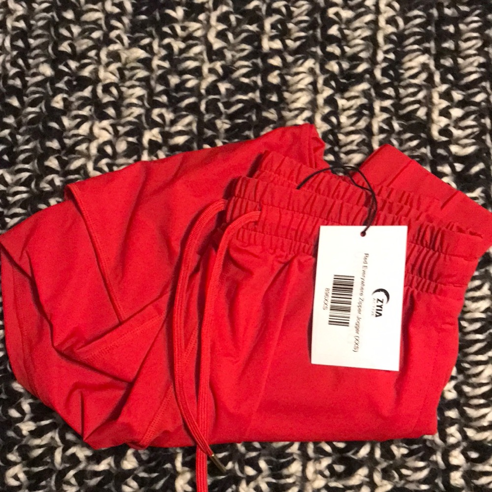 Red Everywhere zipper joggers